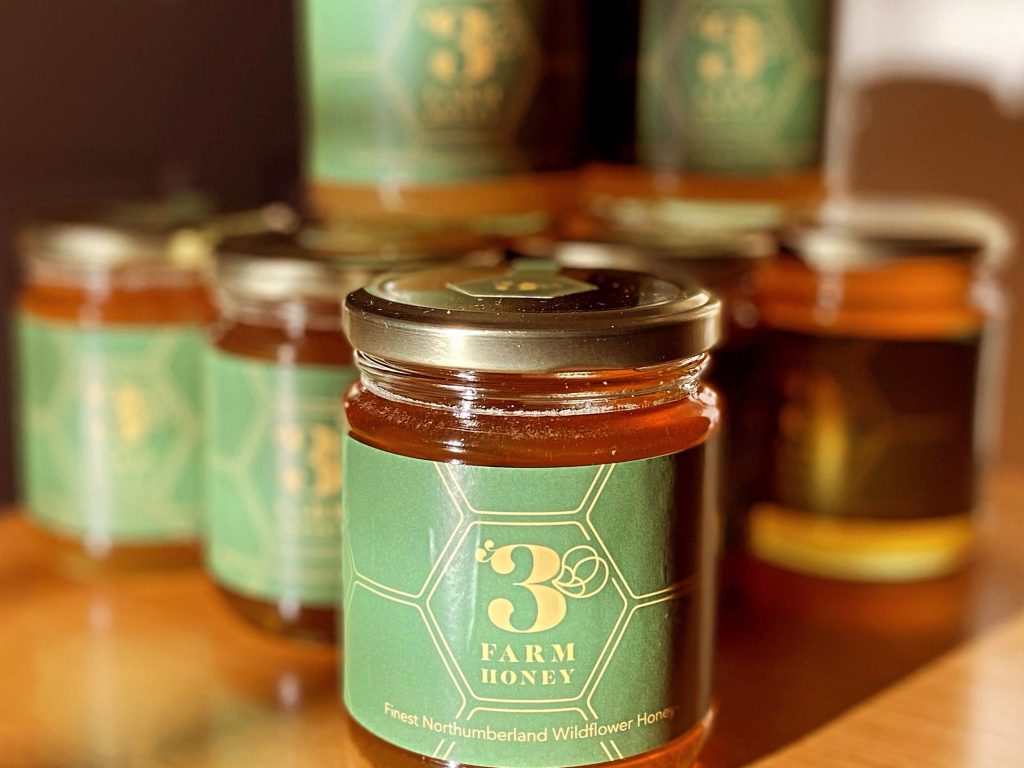 Jar of 3Farm runny Northumberland honey.